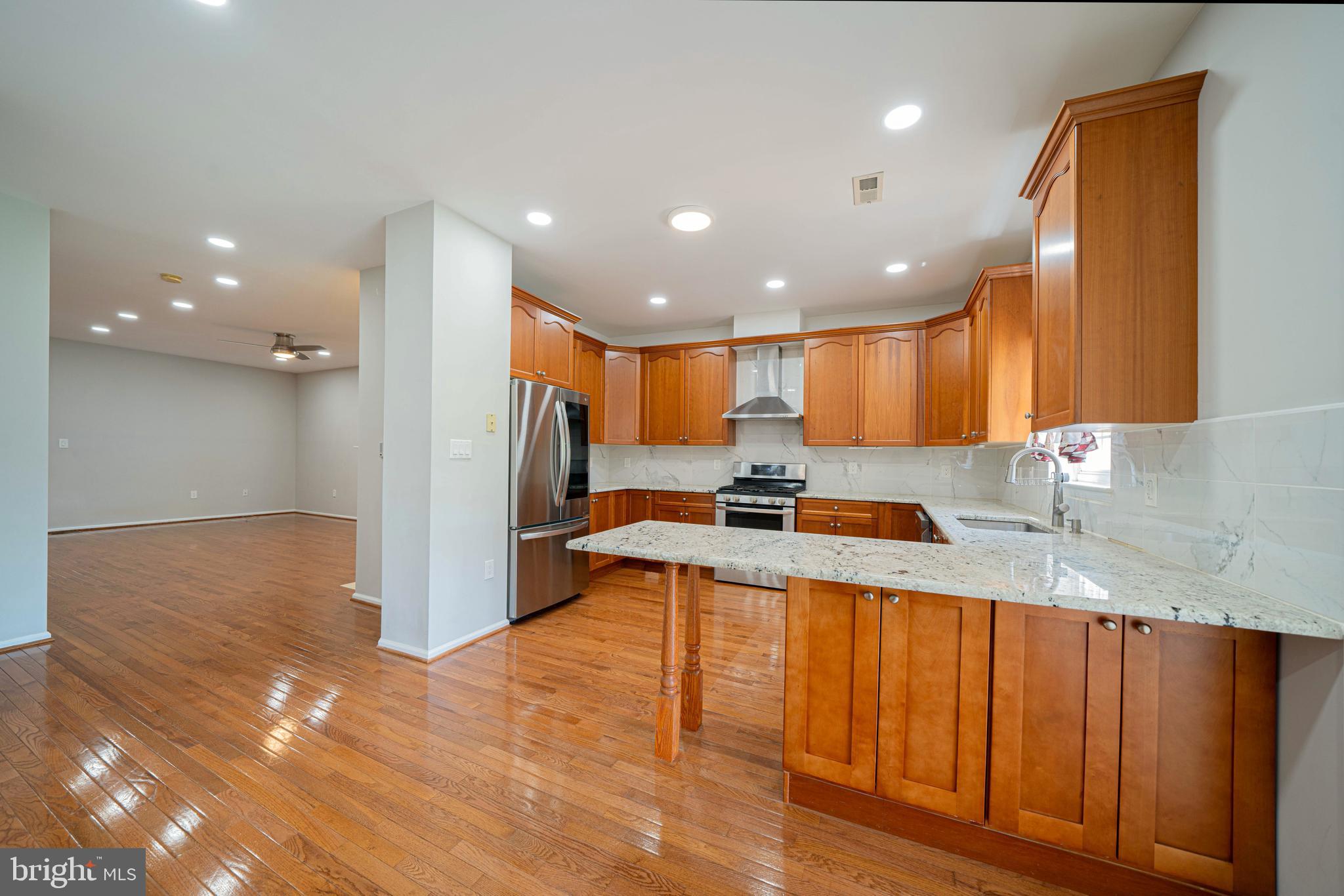 54 Arbor Circle Colmar, PA 18915 - Photo 19 of 74 a large kitchen with stainless steel appliances granite countertop a sink and a stove