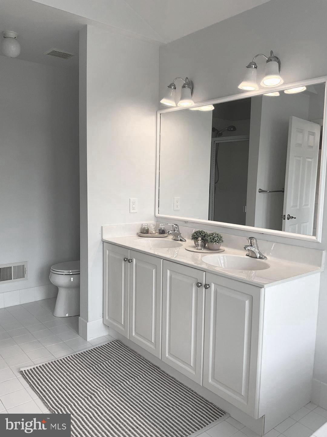 54 Arbor Circle Colmar, PA 18915 - Photo 41 of 74 a spacious bathroom with a double vanity sink and a mirror