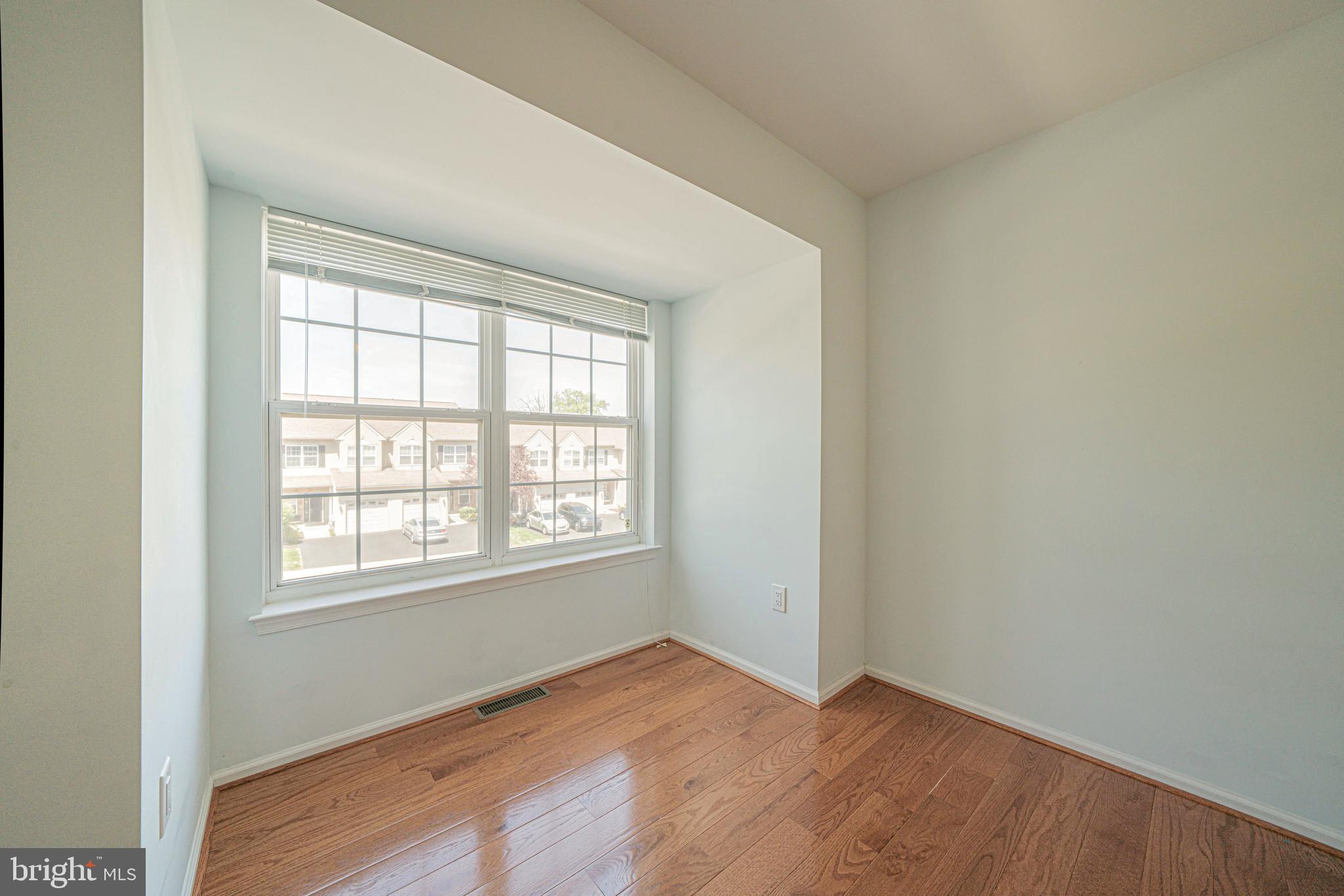 54 Arbor Circle Colmar, PA 18915 - Photo 45 of 74 an empty room with wooden floor and windows