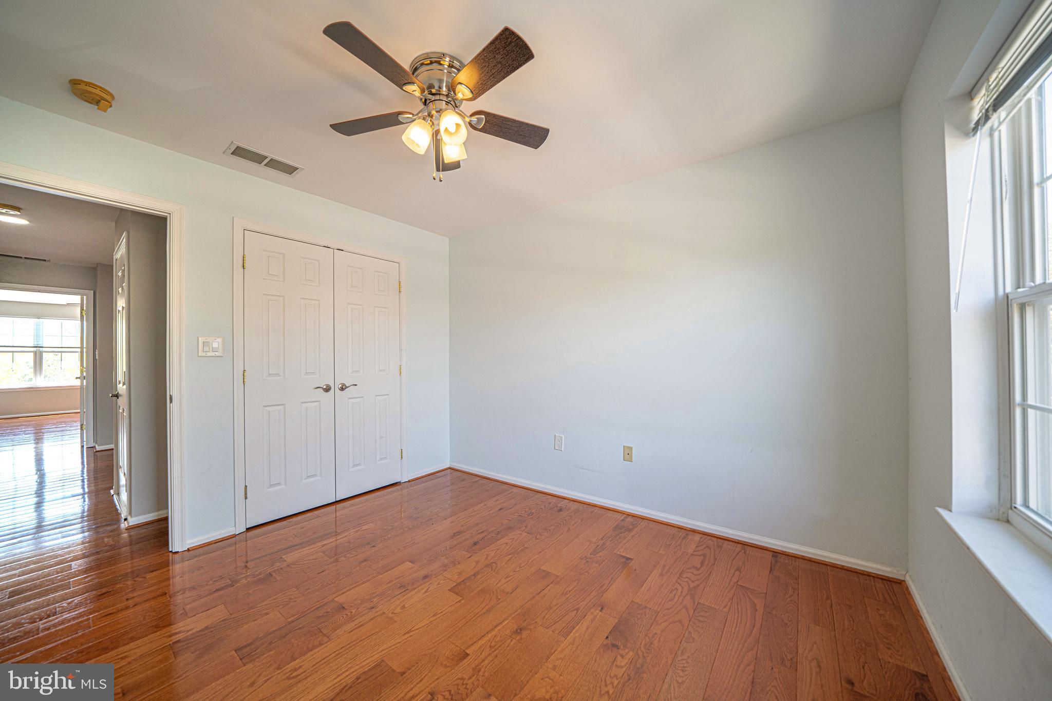 54 Arbor Circle Colmar, PA 18915 - Photo 50 of 74 an empty room with wooden floor and windows