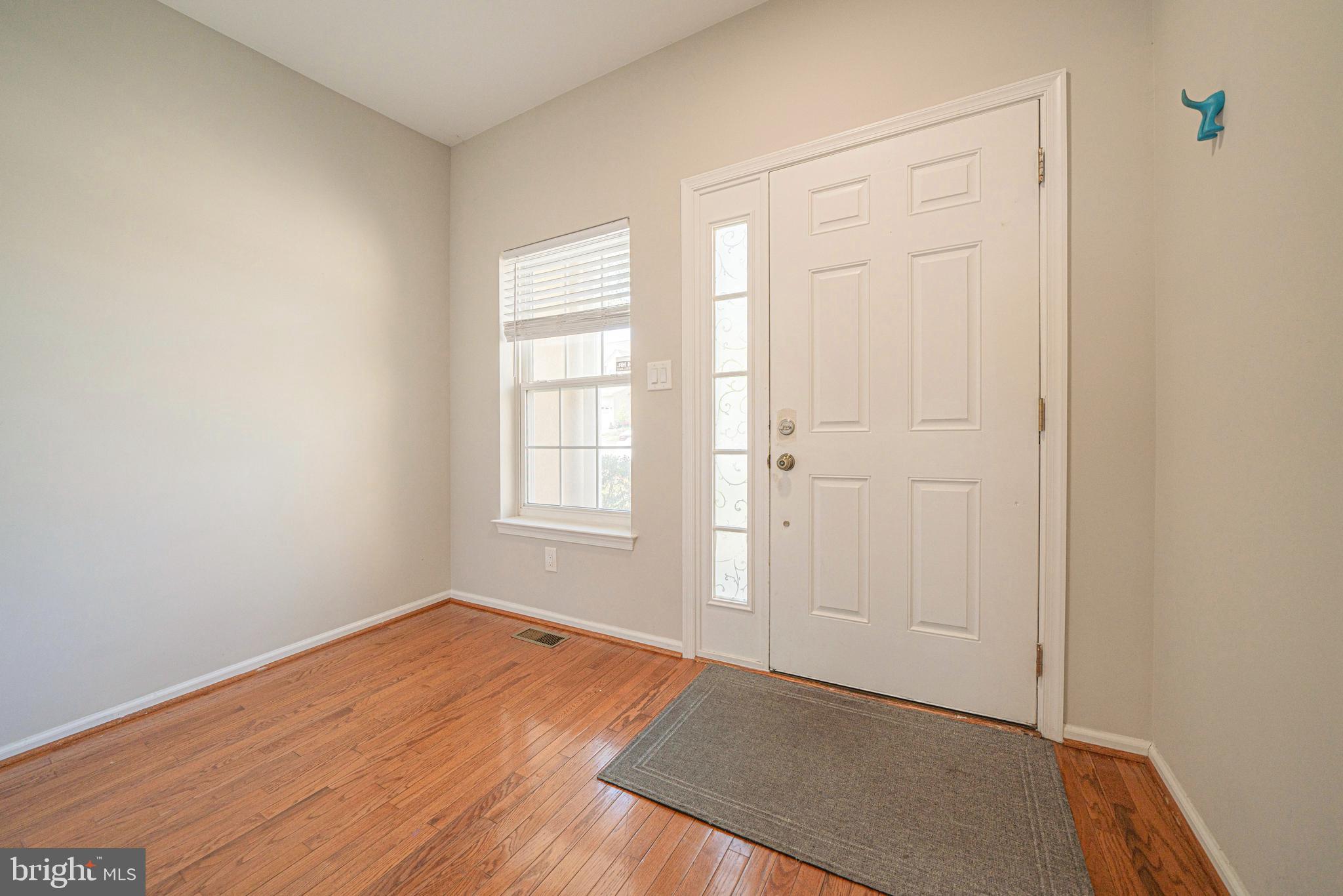54 Arbor Circle Colmar, PA 18915 - Photo 5 of 74 an empty room with wooden floor and windows