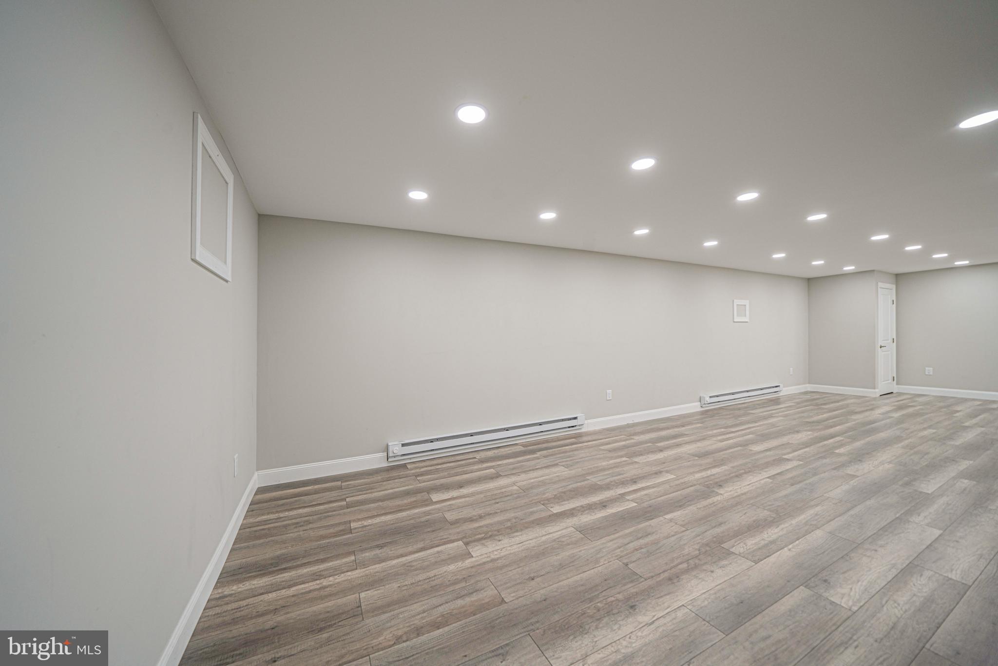 54 Arbor Circle Colmar, PA 18915 - Photo 67 of 74 an empty room with wooden floor and windows