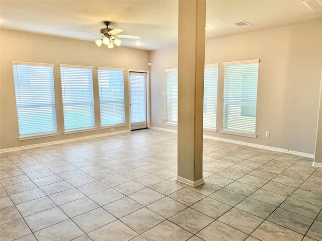 a view of an empty room and window