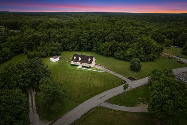 a view of a water with a yard
