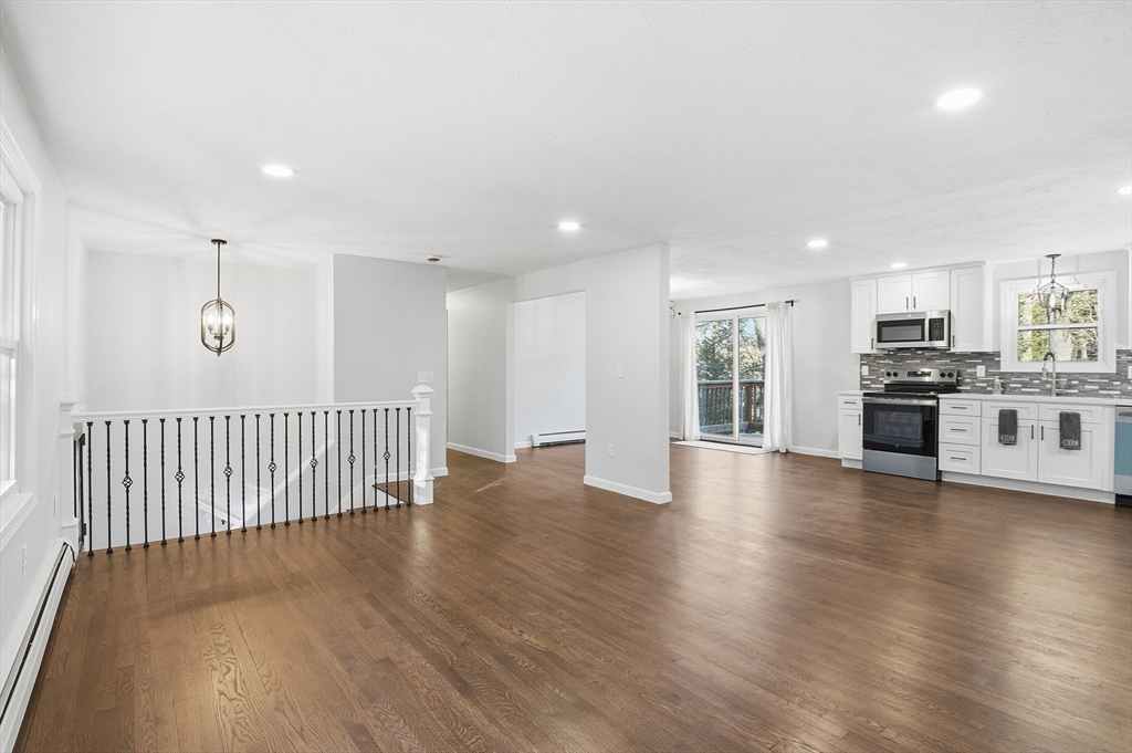 2 Laurel Lane Spencer, MA 01562 - Photo 11 of 42 a view of a kitchen with a sink and dishwasher a stove with wooden floor