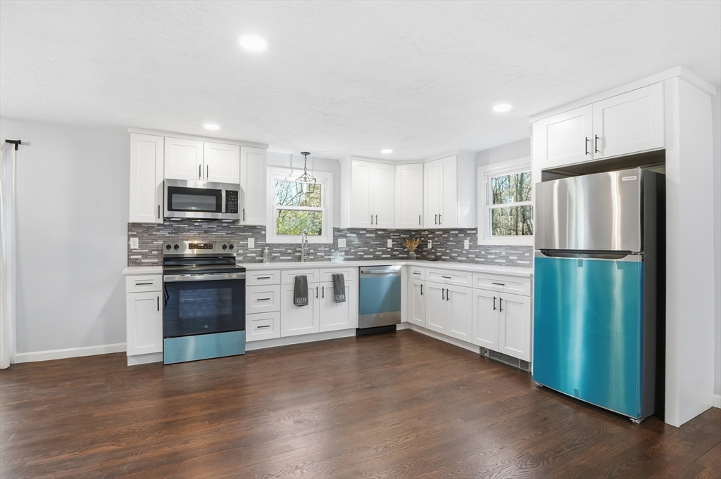 2 Laurel Lane Spencer, MA 01562 - Photo 13 of 42 a kitchen with a refrigerator stove and microwave