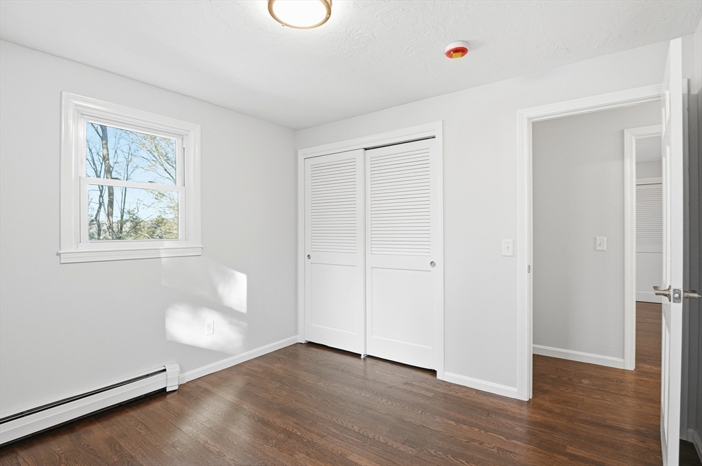 2 Laurel Lane Spencer, MA 01562 - Photo 21 of 42 a view of an empty room with wooden floor and a window