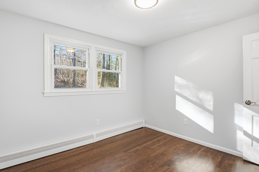 2 Laurel Lane Spencer, MA 01562 - Photo 24 of 42 an empty room with wooden floor and windows