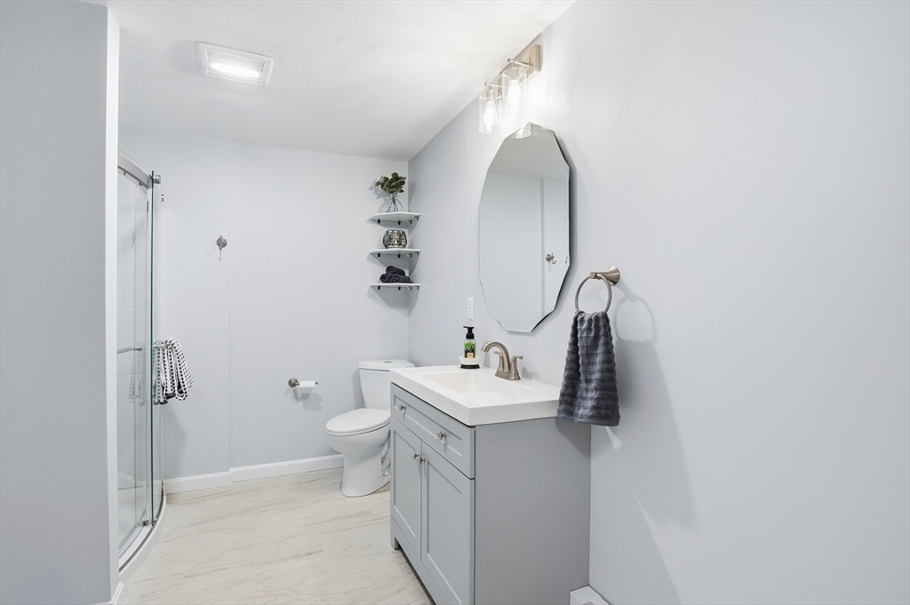 2 Laurel Lane Spencer, MA 01562 - Photo 27 of 42 a bathroom with a sink and mirror with toilet
