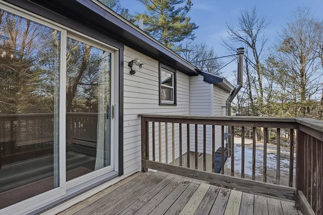 a view of wooden balcony with a swing
