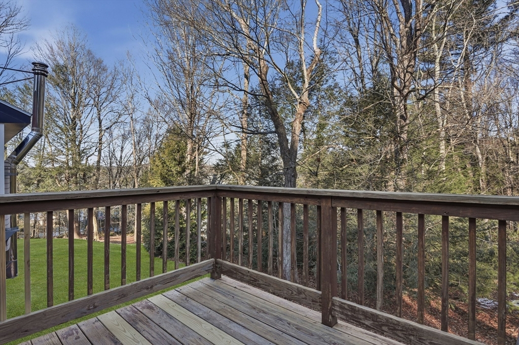 2 Laurel Lane Spencer, MA 01562 - Photo 33 of 42 a balcony with wooden floor and fence