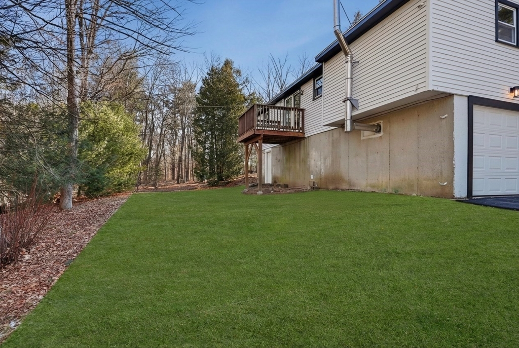2 Laurel Lane Spencer, MA 01562 - Photo 38 of 42 a view of a white house in front of a yard with large tree