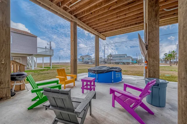a outdoor space with patio the couches and pool table with chairs