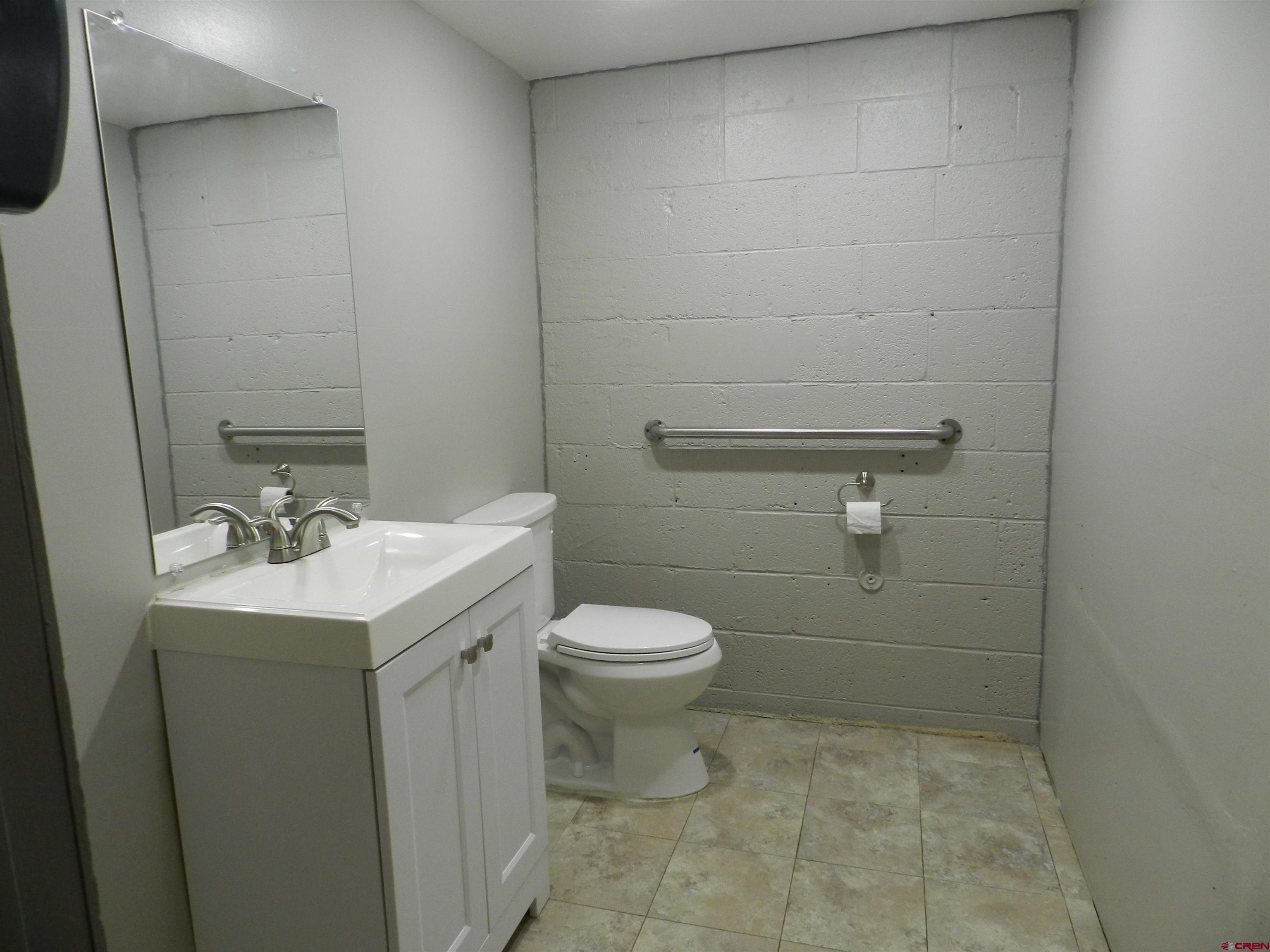 202 East Main Street Montrose, CO 81401 - Photo 28 of 29 a bathroom with a sink toilet and vanity