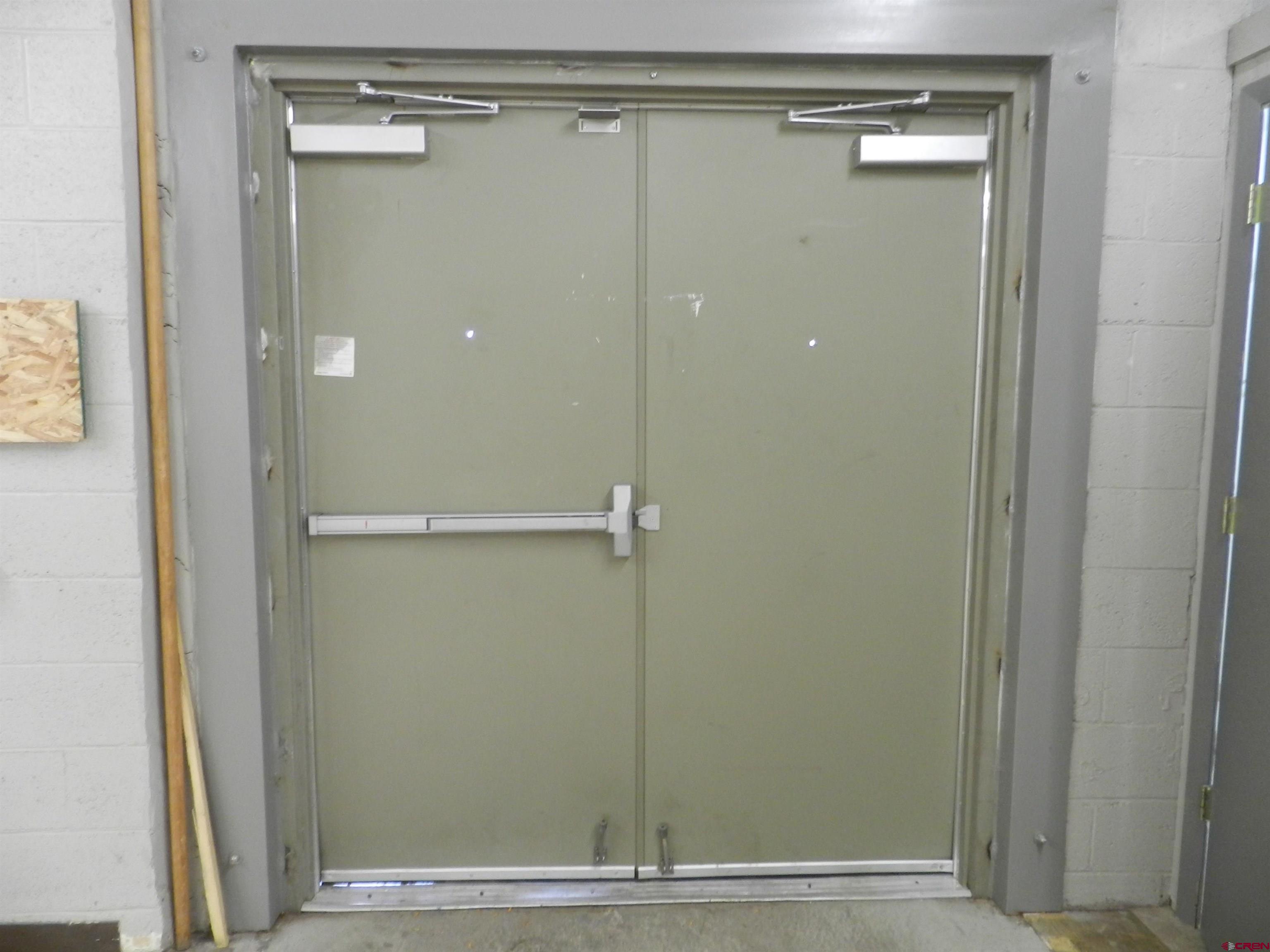 202 East Main Street Montrose, CO 81401 - Photo 29 of 29 a bathroom with a glass shower door