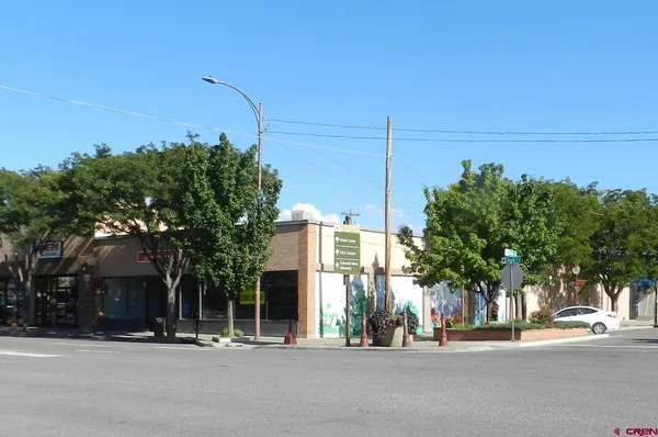 a view of a street with houses on both side