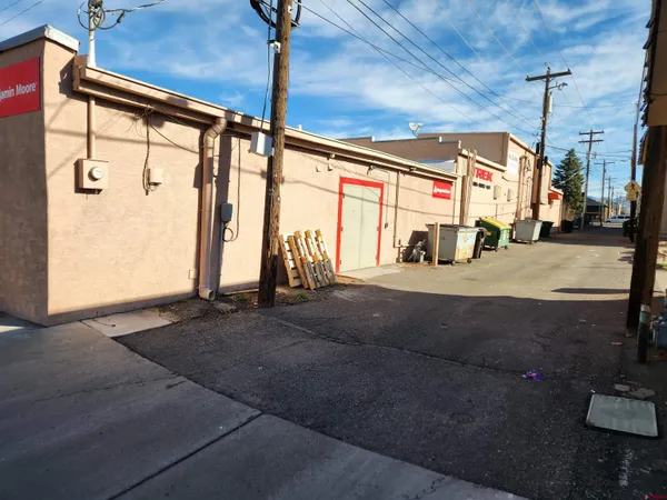 a view of a street with seating space