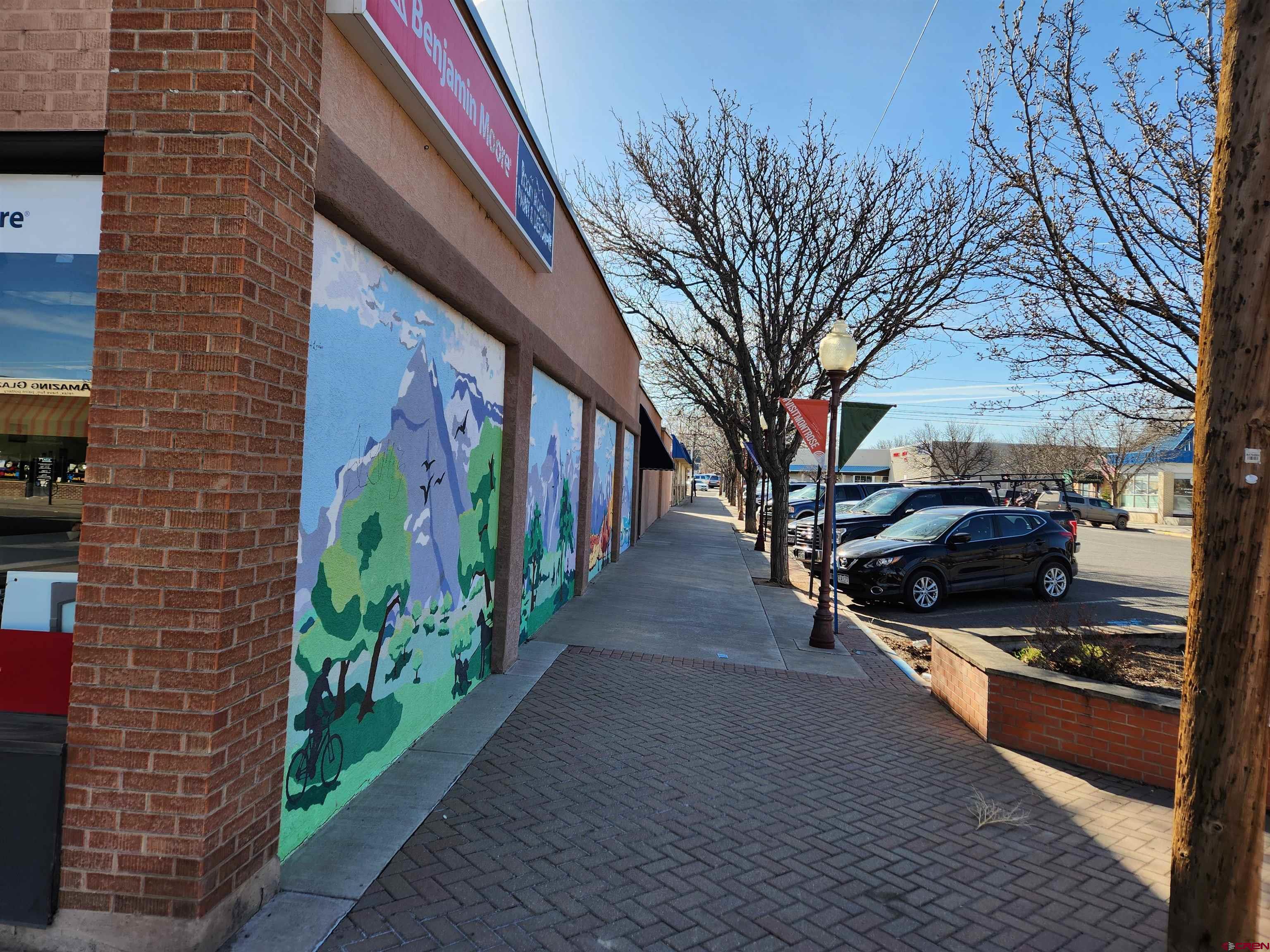 202 East Main Street Montrose, CO 81401 - Photo 5 of 29 a view of a pathway along the building