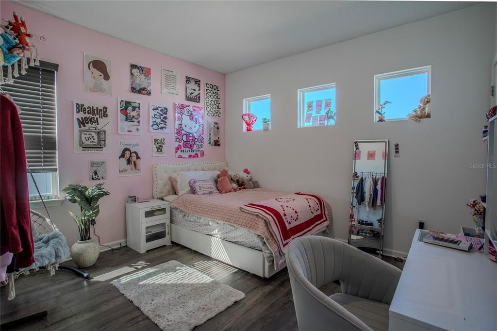 4724 Cragmere Loop Clermont, FL 34711 - Photo 25 of 37 a bedroom with a bed and a couch