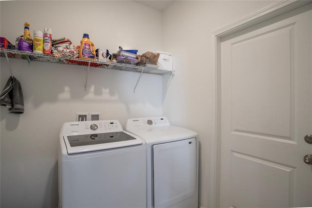4724 Cragmere Loop Clermont, FL 34711 - Photo 27 of 37 a utility room with dryer and washer