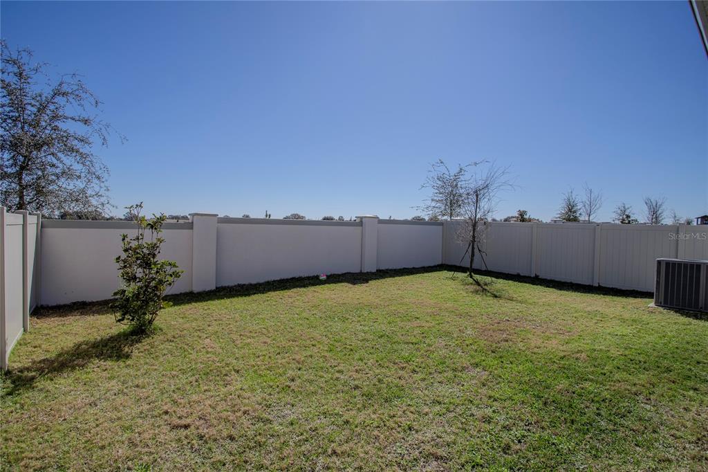 4724 Cragmere Loop Clermont, FL 34711 - Photo 31 of 37 a backyard of a house
