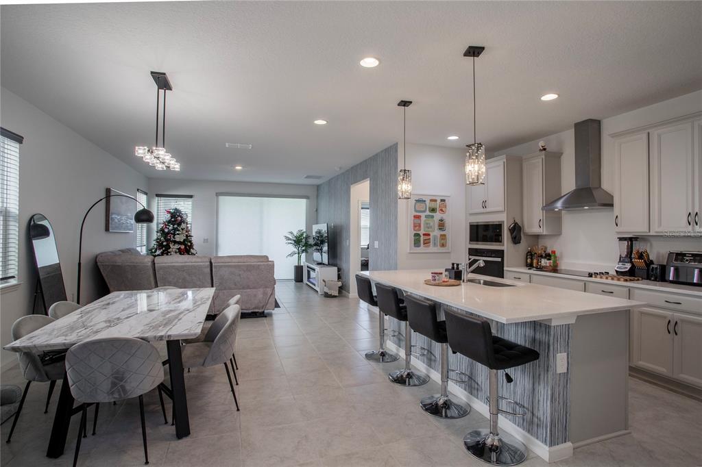 4724 Cragmere Loop Clermont, FL 34711 - Photo 5 of 37 a large kitchen with a table and chairs