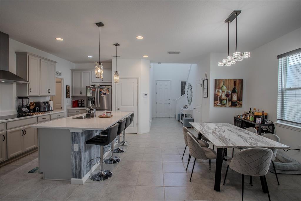 4724 Cragmere Loop Clermont, FL 34711 - Photo 10 of 37 a large kitchen with a table and chairs