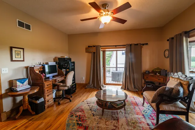 a bathroom with a sink mirror and toilet