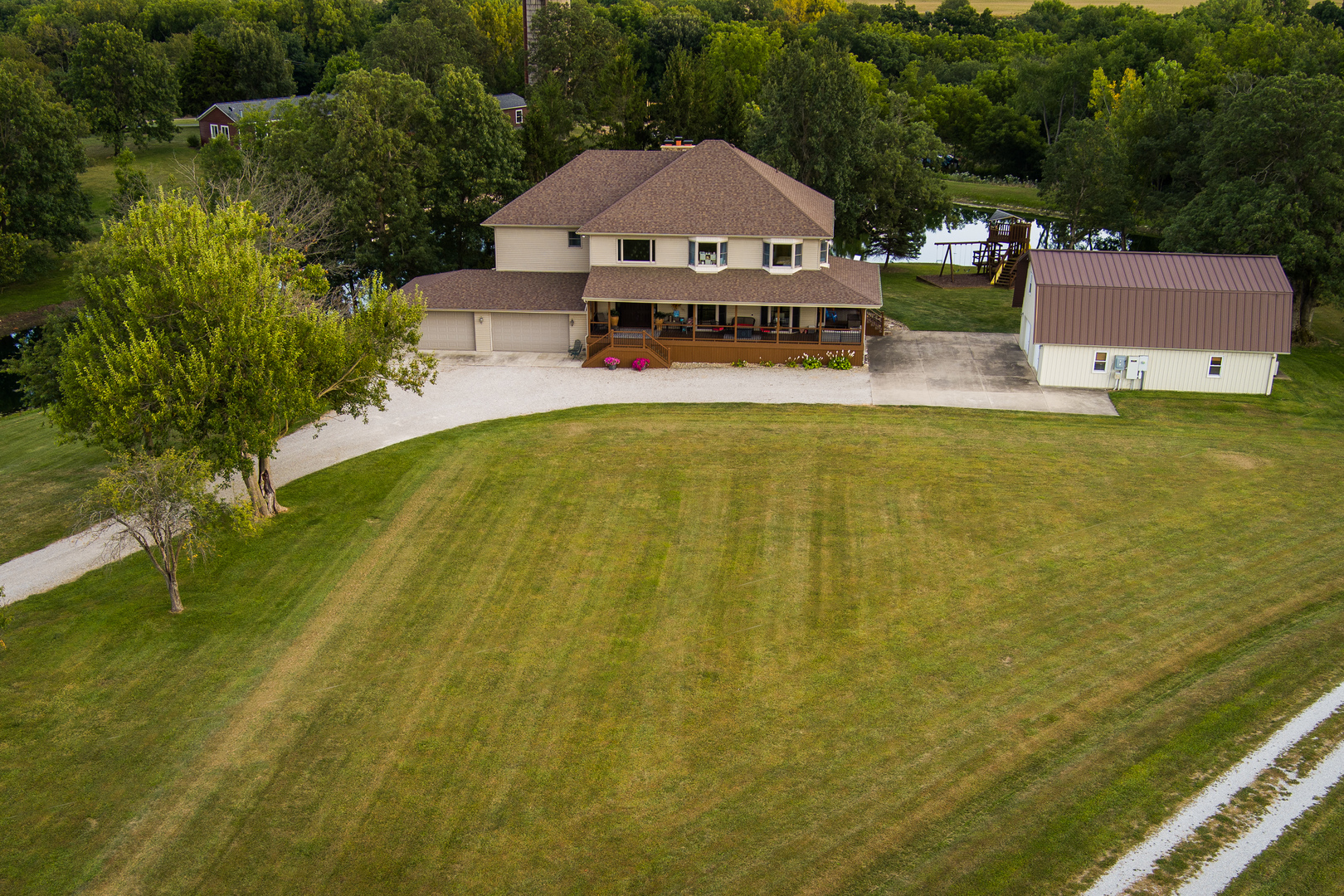 4789 Leghorn Road Clinton, IL 61727 - Photo 2 of 84 a aerial view of a house with swimming pool next to a yard