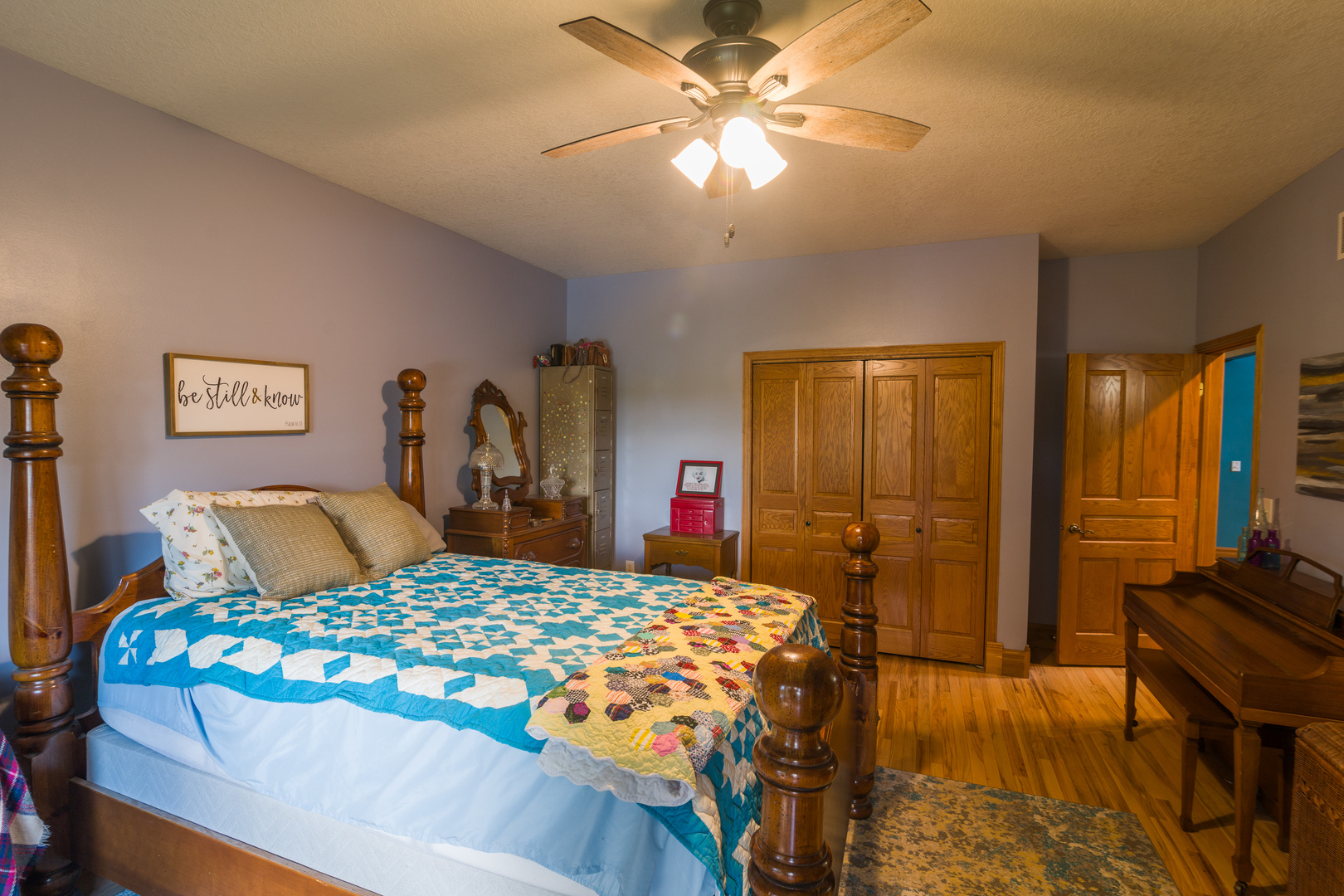 4789 Leghorn Road Clinton, IL 61727 - Photo 23 of 84 a bedroom with a bed and a chandelier