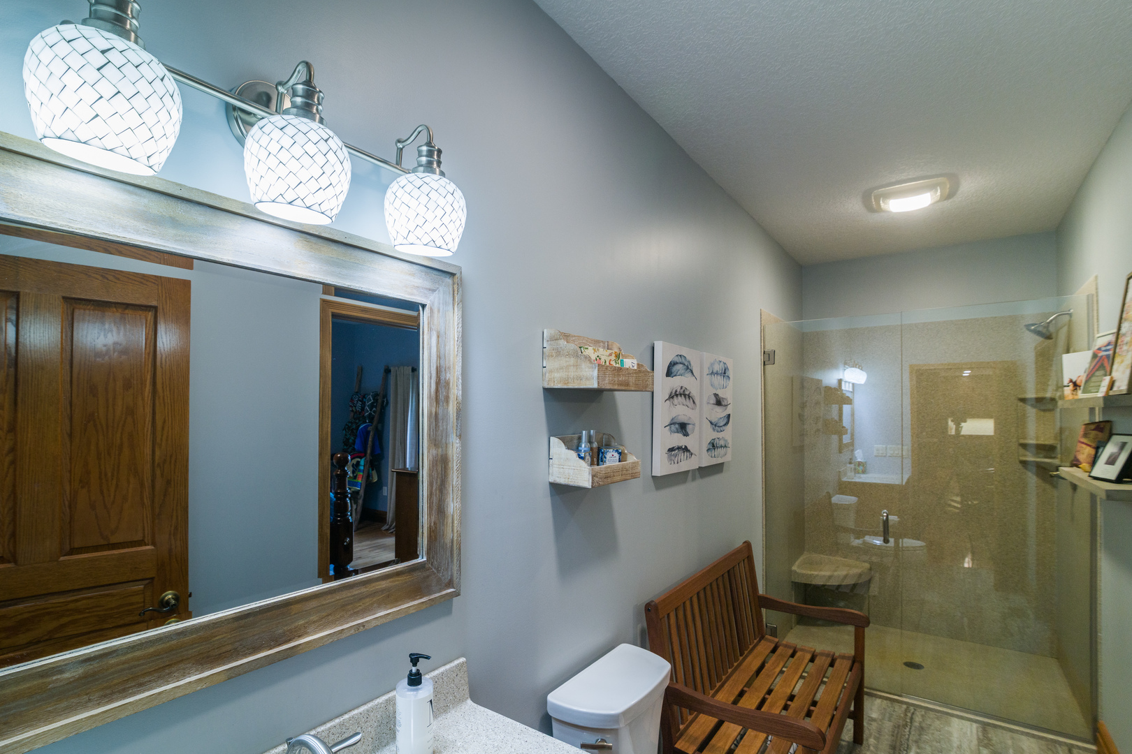 4789 Leghorn Road Clinton, IL 61727 - Photo 25 of 84 a bathroom with a sink mirror and toilet