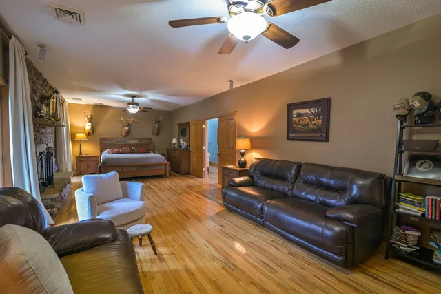 a view of a dining room with furniture and wooden floor