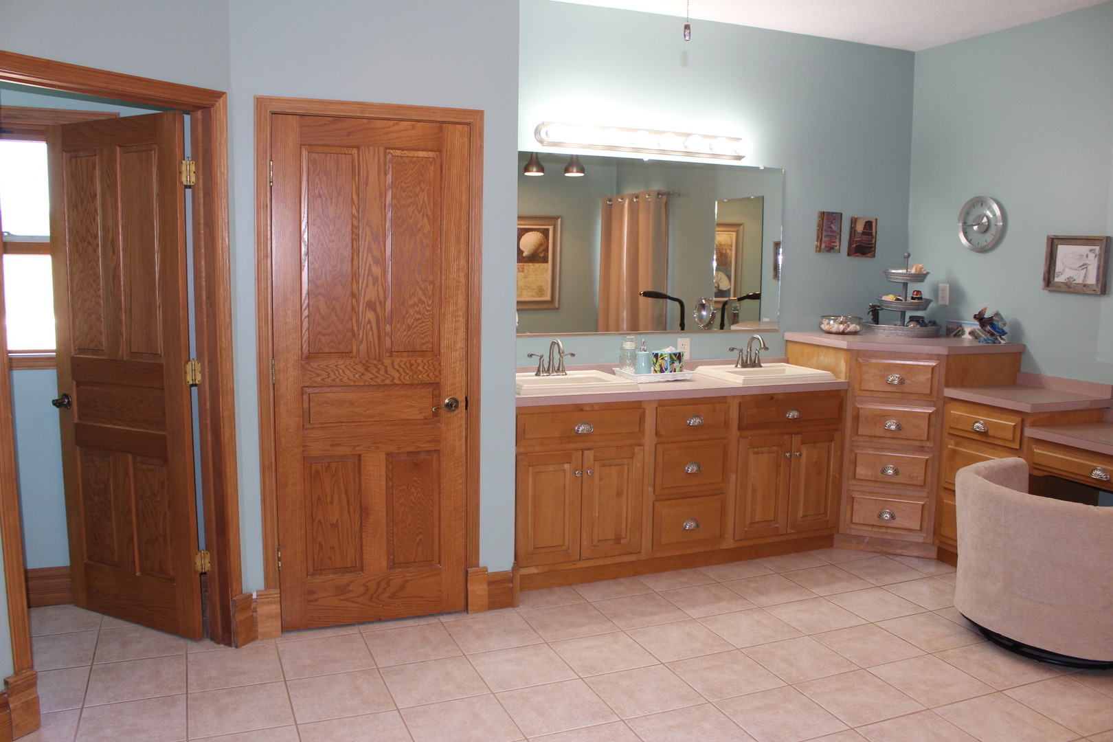 4789 Leghorn Road Clinton, IL 61727 - Photo 35 of 84 a spacious bathroom with a double vanity sink and a mirror