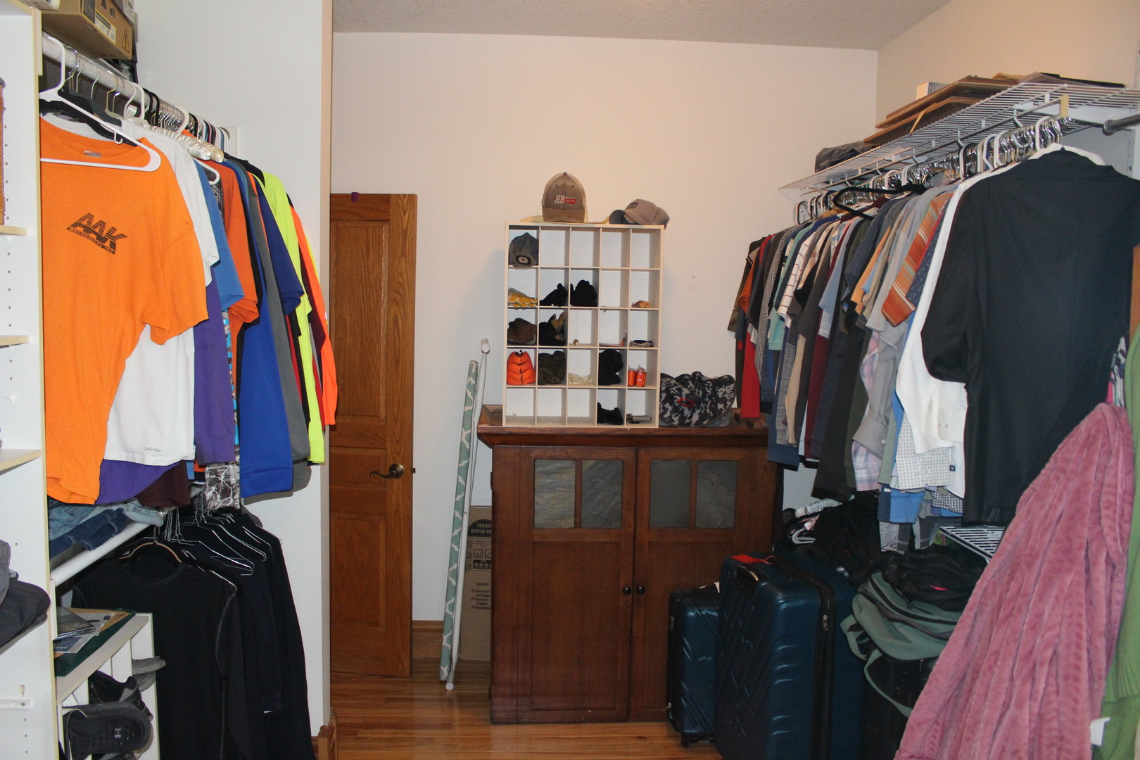 4789 Leghorn Road Clinton, IL 61727 - Photo 40 of 84 a view of walk in closet with clothes and shoes