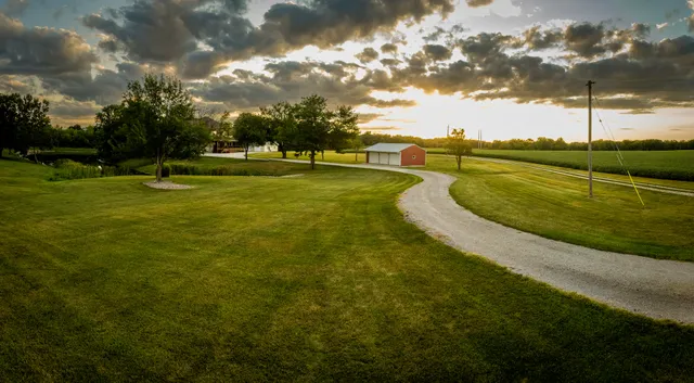 a view of a swimming pool with a yard