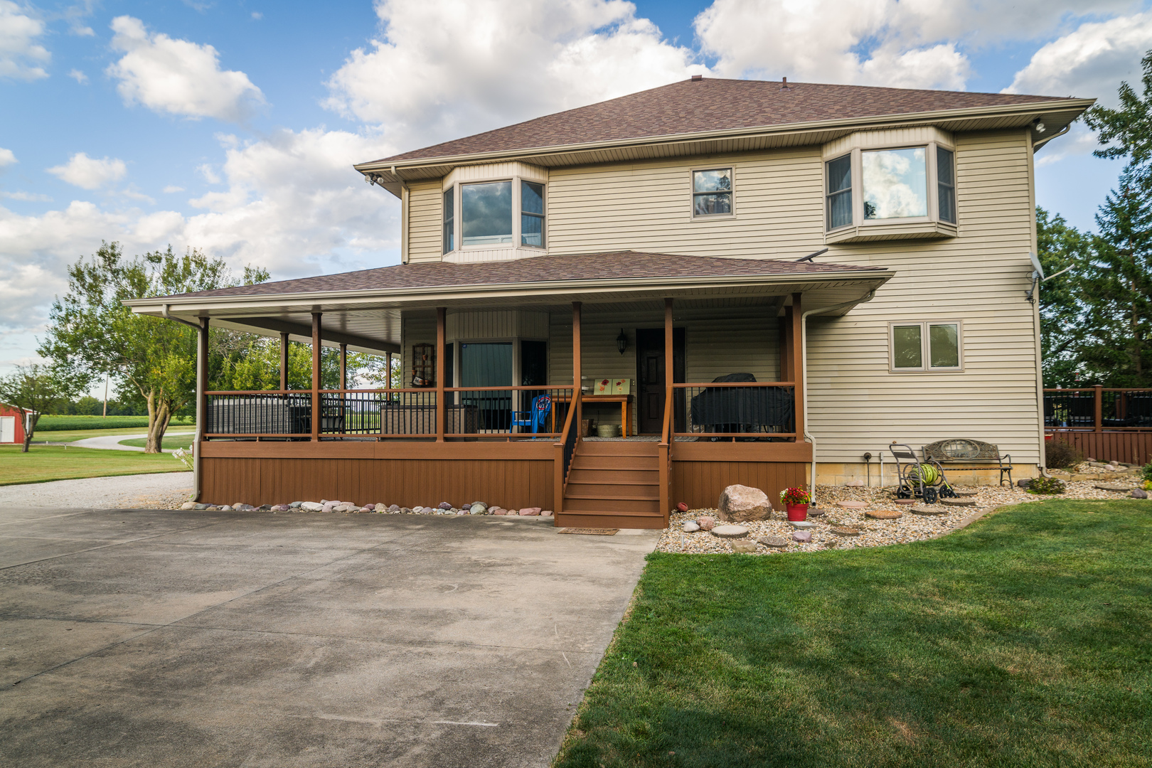 4789 Leghorn Road Clinton, IL 61727 - Photo 69 of 84 a view of a house with sitting area and garden