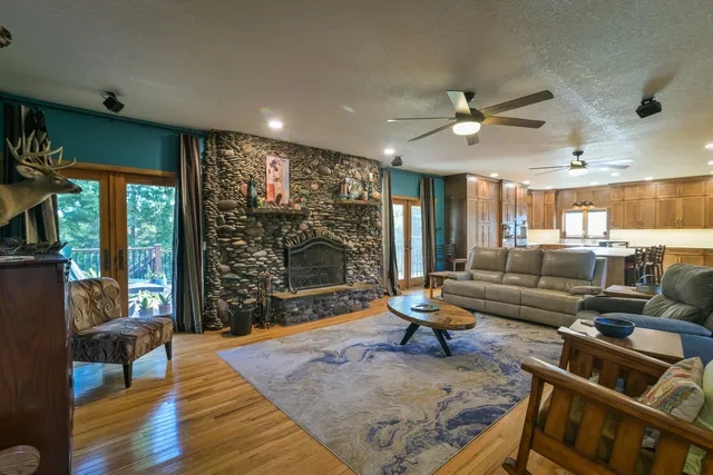 a kitchen with stainless steel appliances granite countertop a refrigerator and a stove