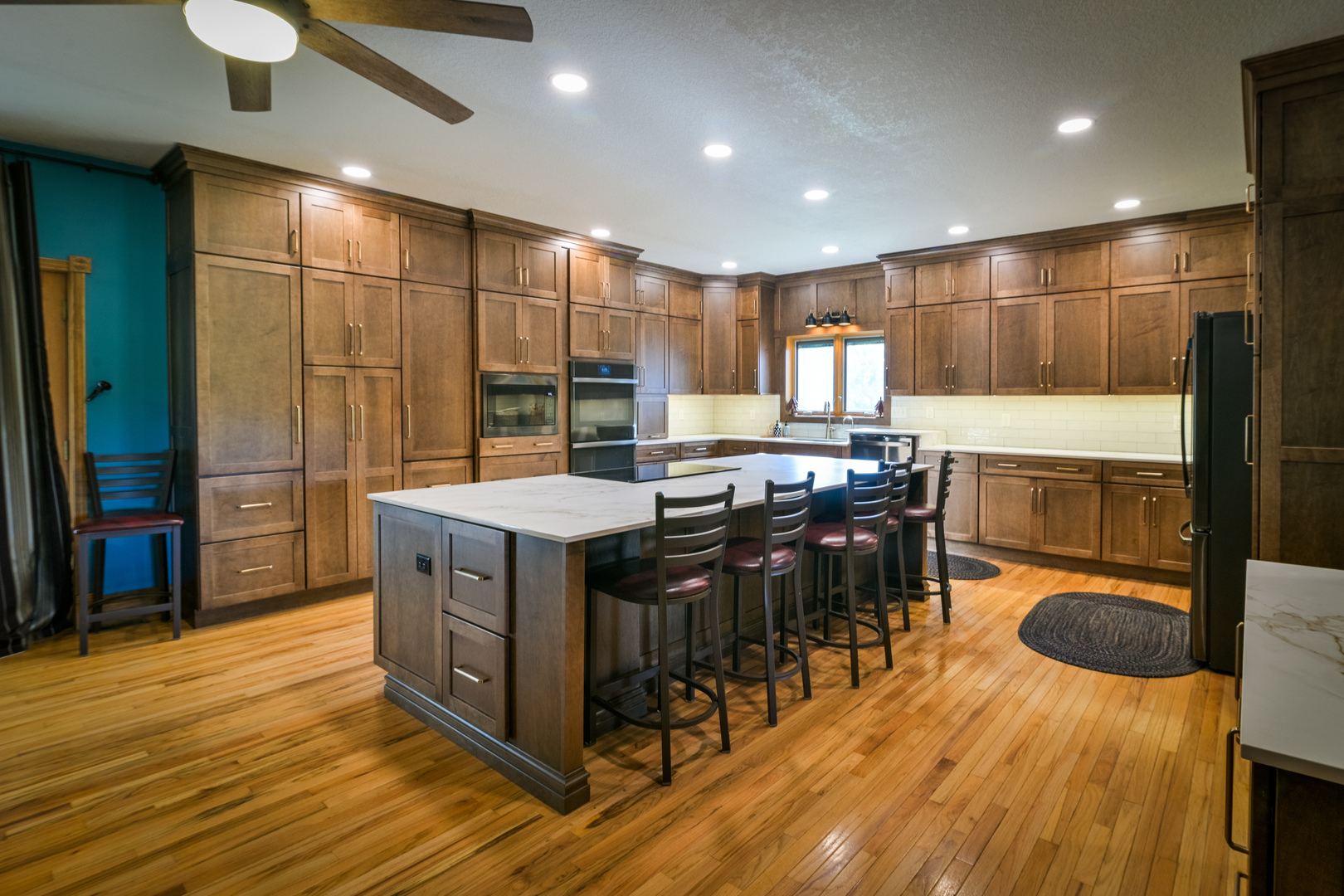 4789 Leghorn Road Clinton, IL 61727 - Photo 10 of 84 a kitchen with kitchen island granite countertop wooden floors and a sink
