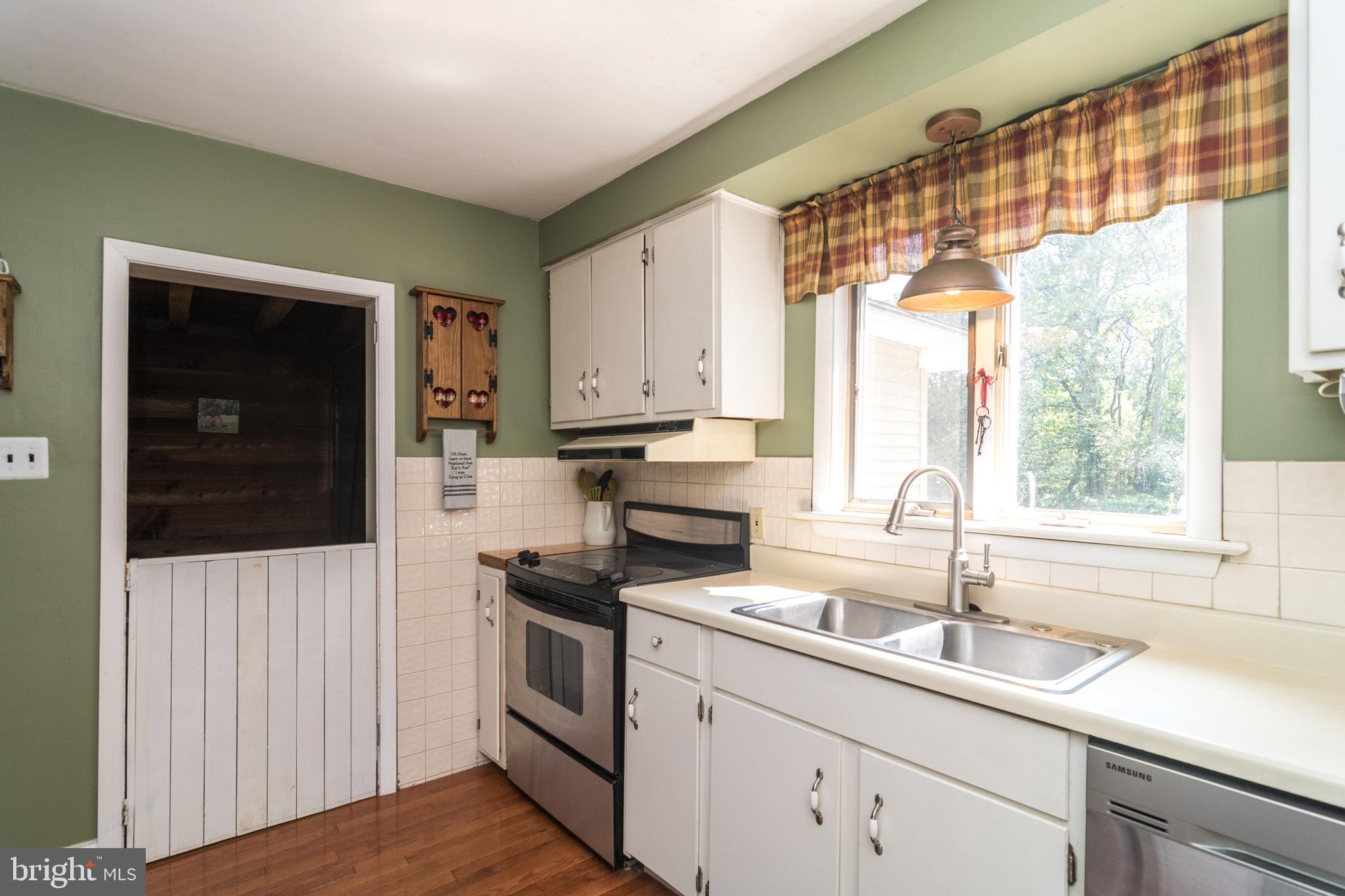 1933 Lower State Road Doylestown, PA 18901 - Photo 14 of 54 a kitchen with a sink window and cabinets