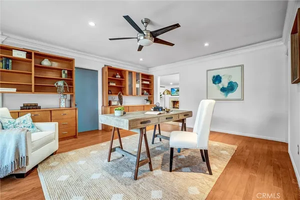 a room with lots of furniture and a view of living room