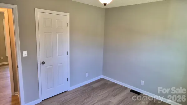 a bathroom with a toilet and bathtub