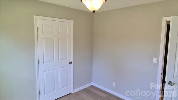 a view of a room with a window and chandelier