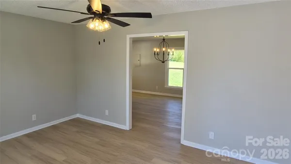 a kitchen with a sink a stove a refrigerator and cabinets