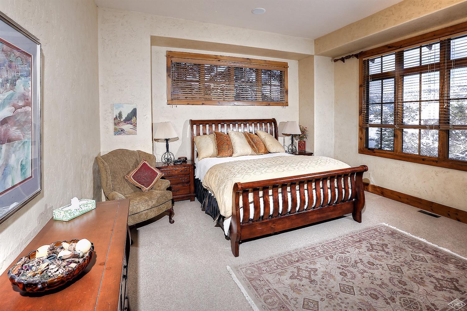 161 Fall Creek Road Edwards, CO 81632 - Photo 5 of 16 a bedroom with a bed window and a lamp with window