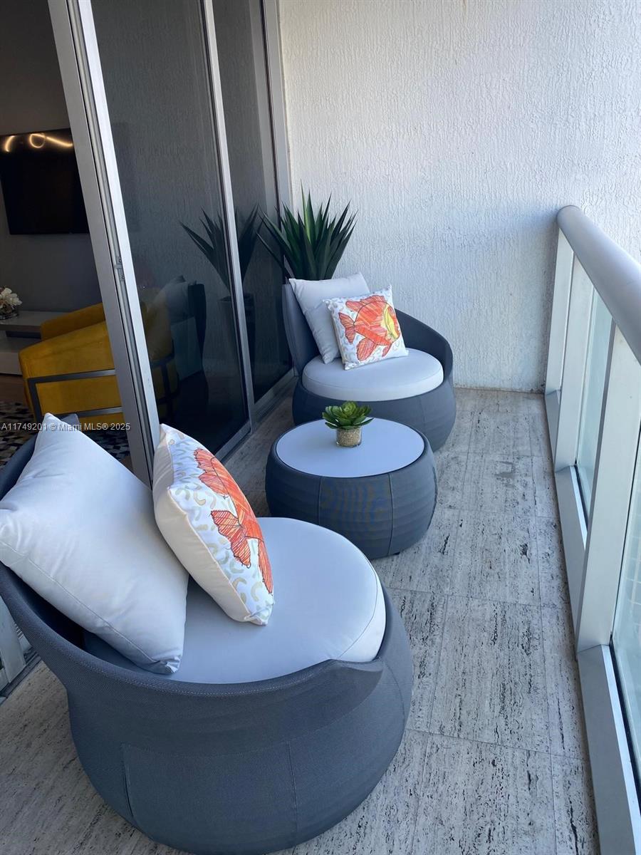 485 Brickell Avenue, Unit 2603 Miami, FL 33131 - Photo 11 of 16 a living room with furniture and a couch