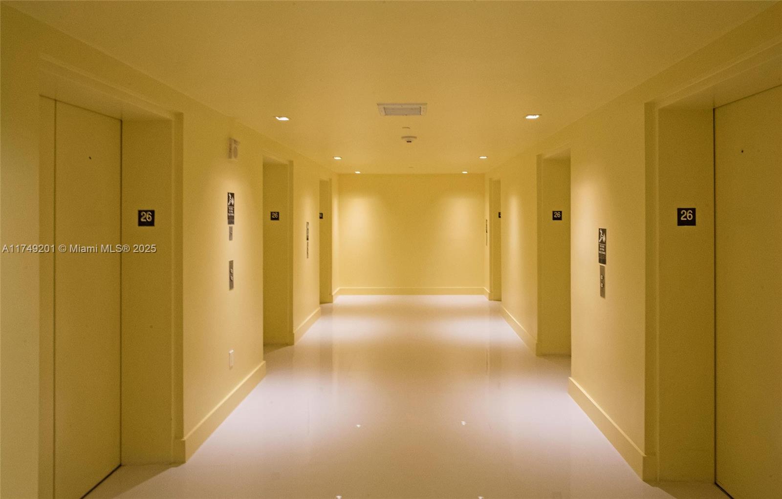 485 Brickell Avenue, Unit 2603 Miami, FL 33131 - Photo 16 of 16 a view of a hallway with wooden shelves