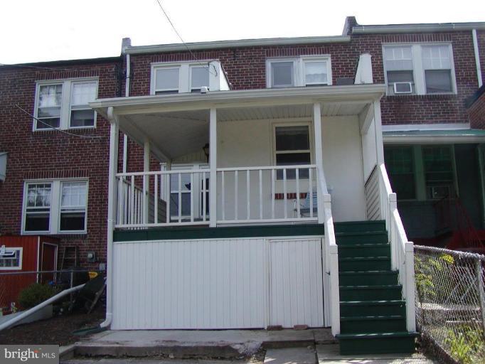920 Calwell Road Baltimore, MD 21229 - Photo 2 of 5 front view of a house with a small yard