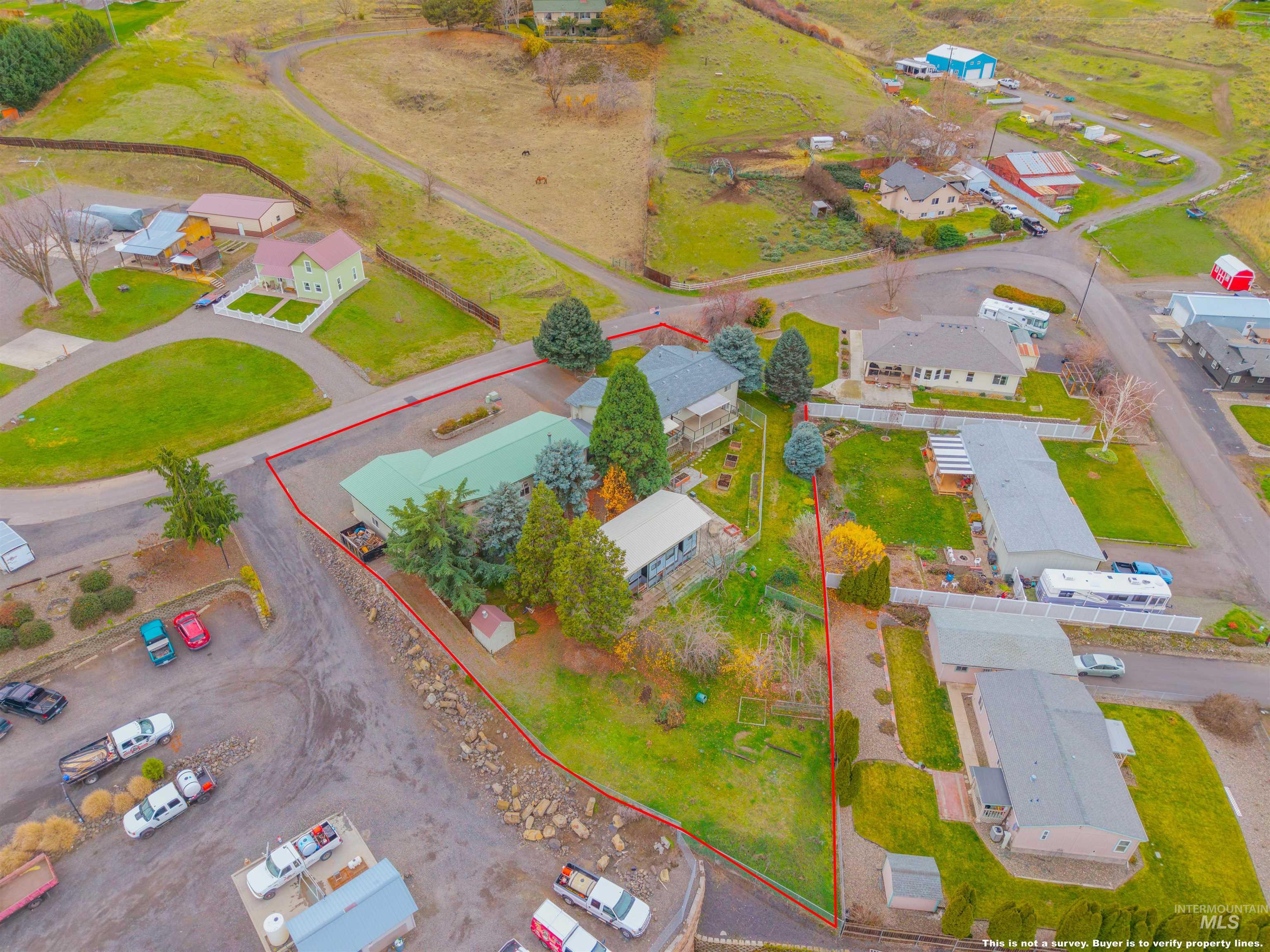 Aerial view of residential area with property boundaries highlighted