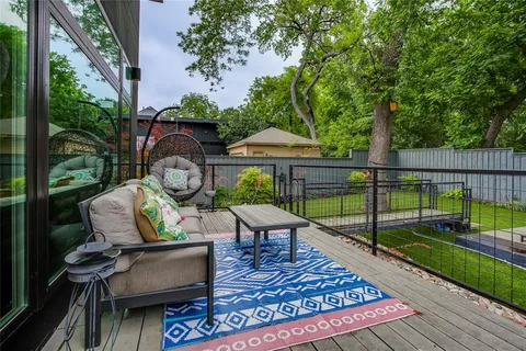 swimming pool view with a seating space