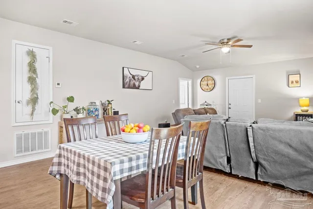 a view of a dining room with furniture